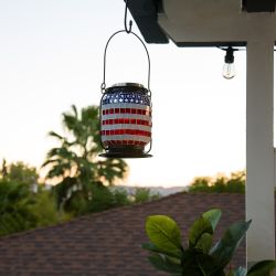 Alpine Corporation 7" Tall Hanging Solar Powered Outdoor Patriotic Lantern with LED Lights